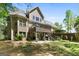 Expansive two-story home features a walk out basement, multi-level deck, and beautifully landscaped yard at 1561 Aiken Chafin Ln, Mcdonough, GA 30252