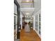 Elegant foyer with high ceilings, hardwood floors, and views into the bright living spaces beyond at 1561 Aiken Chafin Ln, Mcdonough, GA 30252