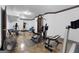 Home gym featuring multiple workout machines and weights, perfect for fitness enthusiasts at 1561 Aiken Chafin Ln, Mcdonough, GA 30252