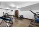 Home gym featuring multiple workout machines and weights, perfect for fitness enthusiasts at 1561 Aiken Chafin Ln, Mcdonough, GA 30252