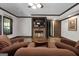 Comfortable living room with a cozy fireplace, TV, plush seating, and ambient lighting at 1561 Aiken Chafin Ln, Mcdonough, GA 30252
