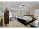 Main bedroom with sitting area, fireplace, and trey ceiling at 1561 Aiken Chafin Ln, Mcdonough, GA 30252