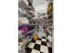 Walk-in pantry with checkerboard flooring and shelving on all sides at 1561 Aiken Chafin Ln, Mcdonough, GA 30252