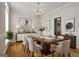 Elegant dining room with hardwood floors, chandelier, and stylish decor at 85 Bloomfield Way, Sharpsburg, GA 30277