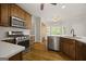 Well-equipped kitchen with stainless steel appliances, quartz countertops, and ample cabinet space at 85 Bloomfield Way, Sharpsburg, GA 30277