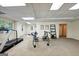 Bright basement gym featuring exercise equipment on neutral carpet with views to the exterior at 508 Hastings Dr, Peachtree City, GA 30269