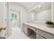 Bright bathroom featuring a double vanity, large mirror, tiled floor, and shower at 508 Hastings Dr, Peachtree City, GA 30269