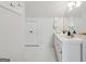 Bright bathroom boasts a large mirror and white cabinetry at 508 Hastings Dr, Peachtree City, GA 30269