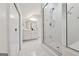 Modern bathroom with glass-enclosed shower, white tile, and sleek fixtures at 508 Hastings Dr, Peachtree City, GA 30269