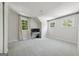 Well-lit room with several windows, neutral paint and carpeting and a desk at 508 Hastings Dr, Peachtree City, GA 30269