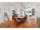 Elegant dining room with terracotta floors, white ceiling, and a table with chairs at 508 Hastings Dr, Peachtree City, GA 30269