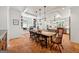Open concept dining room with a large wooden table, lots of natural light, and terra cotta tile floors at 508 Hastings Dr, Peachtree City, GA 30269