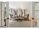 Traditional dining room with chandelier, area rug, neutral walls and bright light from large windows at 508 Hastings Dr, Peachtree City, GA 30269