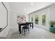Dining room with table set for a meal and doors leading to a balcony at 508 Hastings Dr, Peachtree City, GA 30269