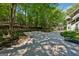 View of long driveway surrounded by trees and vegetation leading to the main house at 508 Hastings Dr, Peachtree City, GA 30269