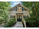 Charming home exterior with a welcoming entrance, a concrete pathway, and lush landscaping at 508 Hastings Dr, Peachtree City, GA 30269