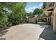 Stunning exterior with porte cochere, large driveway, lush trees, and well-maintained landscaping at 508 Hastings Dr, Peachtree City, GA 30269