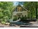 Charming home exterior with a welcoming entrance, a stone pathway, and beautiful landscaping at 508 Hastings Dr, Peachtree City, GA 30269
