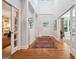 Elegant foyer with hardwood floors, a decorative rug, and bright entryway, creating a grand entrance at 508 Hastings Dr, Peachtree City, GA 30269