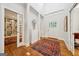 Grand foyer featuring hardwood floors, a decorative rug, and a soaring ceiling that creates a bright and inviting entrance at 508 Hastings Dr, Peachtree City, GA 30269