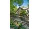 Stunning home featuring a stone steps, landscaped front yard, and welcoming front porch with flag at 508 Hastings Dr, Peachtree City, GA 30269
