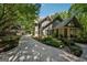 This home features an attractive exterior, long driveway, and lush, well-maintained front yard landscaping at 508 Hastings Dr, Peachtree City, GA 30269