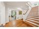 Bright foyer with hardwood floors and stairs leading to the second level of the home at 508 Hastings Dr, Peachtree City, GA 30269