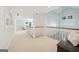 Bright hallway with natural light, carpeted floors, white railings, and open staircase at 508 Hastings Dr, Peachtree City, GA 30269