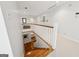 Bright upstairs hallway with hardwood stairs, leading to carpeted area with lots of light at 508 Hastings Dr, Peachtree City, GA 30269