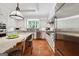 Bright kitchen with stainless steel appliances, a large island and terracotta flooring at 508 Hastings Dr, Peachtree City, GA 30269