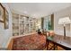 Inviting living room features custom built-in bookshelves, a decorative rug, and natural light perfect for reading or relaxing at 508 Hastings Dr, Peachtree City, GA 30269