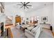 Bright and airy living room with high ceilings, fireplace, and comfortable seating, with views to dining area at 508 Hastings Dr, Peachtree City, GA 30269