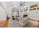 Bright living room with vaulted ceilings, beams, a fireplace, and large windows at 508 Hastings Dr, Peachtree City, GA 30269