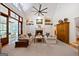 Bright living room featuring fireplace, built-in shelving, and large window doors at 508 Hastings Dr, Peachtree City, GA 30269
