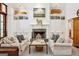 Cozy living room with fireplace, built-in shelving, and comfortable seating at 508 Hastings Dr, Peachtree City, GA 30269