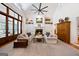Spacious living room with a large fireplace, built-in shelving, and high ceilings at 508 Hastings Dr, Peachtree City, GA 30269