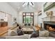Cozy living room featuring fireplace, built-in shelving and plush seating at 508 Hastings Dr, Peachtree City, GA 30269