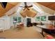 Spacious office featuring vaulted wood ceilings, built-in shelving, and dual desk spaces at 508 Hastings Dr, Peachtree City, GA 30269