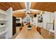 Open office area with wood ceilings, white bookcases, a conference area and desk at 508 Hastings Dr, Peachtree City, GA 30269