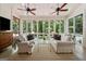 Enclosed sunroom with plenty of natural light and comfortable seating at 508 Hastings Dr, Peachtree City, GA 30269