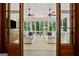 Bright sunroom with large windows and comfortable seating at 508 Hastings Dr, Peachtree City, GA 30269