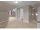 Neutral-toned bonus room with carpet, storage closet and dormer windows for lots of light at 506 Brewer Dr, Locust Grove, GA 30248