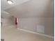 Large bonus room with carpet, neutral paint, and windows that allow plenty of natural light at 506 Brewer Dr, Locust Grove, GA 30248