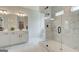 A bright bathroom with a walk-in shower and a double vanity with two sinks at 43 Avian Way # 3B, Auburn, GA 30011