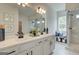 Stylish bathroom with double vanity, walk-in shower, and tiled floor at 43 Avian Way # 3B, Auburn, GA 30011