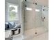 A new bathroom featuring a walk-in glass shower and tiled bench at 43 Avian Way # 3B, Auburn, GA 30011
