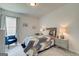 Comfortable bedroom with carpet, a patterned bedspread, and matching end tables, offering a peaceful retreat at 43 Avian Way # 3B, Auburn, GA 30011