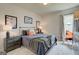 Serene bedroom featuring neutral tones, plush carpeting, and tasteful decor, creating a relaxing atmosphere at 43 Avian Way # 3B, Auburn, GA 30011