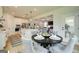 Charming dining area connected to an open concept kitchen with modern appliances and island seating at 43 Avian Way # 3B, Auburn, GA 30011