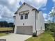 Charming two-story home with a two-car garage and well-manicured lawn at 43 Avian Way # 3B, Auburn, GA 30011